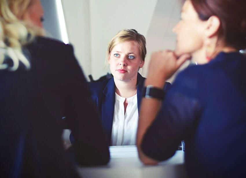 Services Three Women Sitting Beside Table